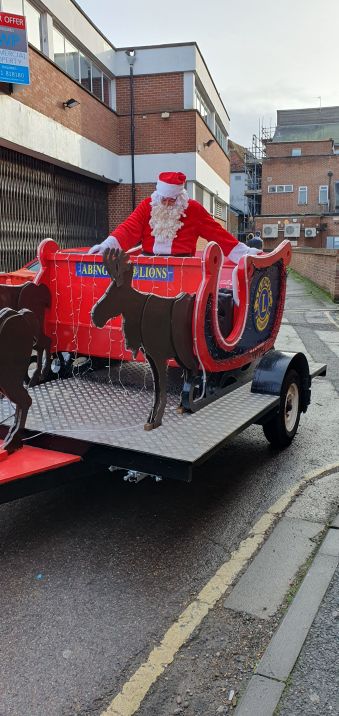 Santa sitting on their sleigh